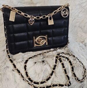 Elegant Black Quilted Crossbody Bag with Gold Accents